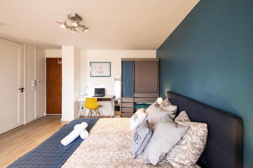 En eller flere senge i et værelse på Le cottage roannais