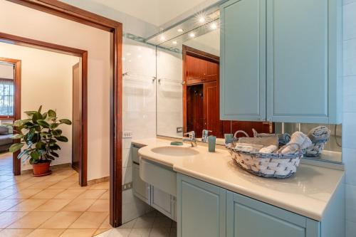 a bathroom with a sink and a mirror at La Casina Di Loriana in Altopascio