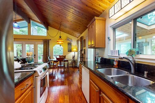 a kitchen with a sink and a counter top at Feelin' Beachy in Gualala