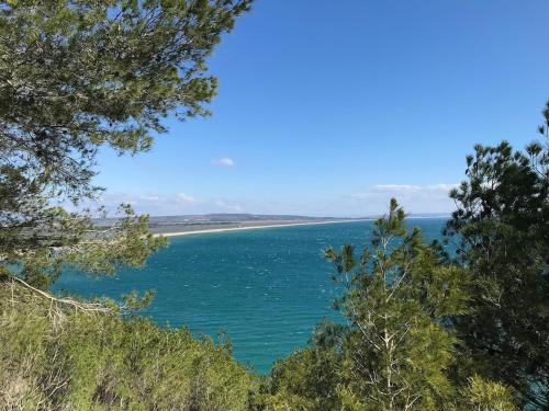 a view of the ocean from a bluff at Charmant Appartement sur le Port de Port Leucate in Leucate-Plage