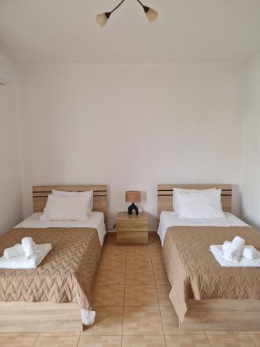 Ένα ή περισσότερα κρεβάτια σε δωμάτιο στο Villa Nefeli