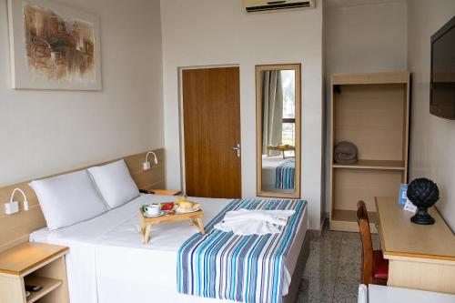 Postel nebo postele na pokoji v ubytování Hotel Dan Inn Barretos by Nacional Inn