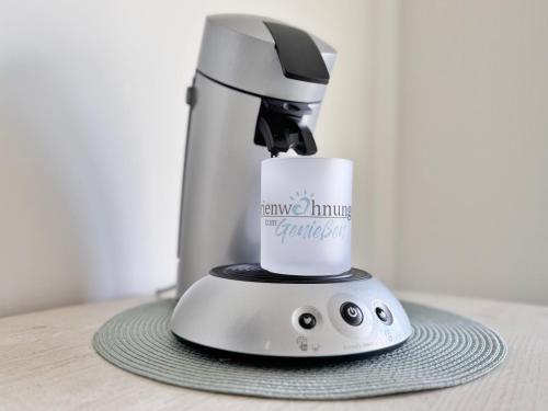 a blender sitting on top of a table at Ferienhaus Nordprinz mit Sauna und Whirlpool in Geestland