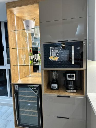 a kitchen with a counter with a coffee maker at A resort style apartment with ocean views with two bedrooms in Panama City