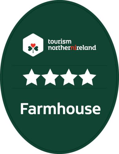 a green sign for a farmhouse with four stars at Arch House in Florencecourt