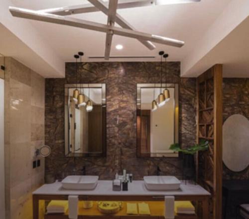 a bathroom with two sinks and a large mirror at Vidanta Nuevo Vallarta in Nuevo Vallarta 