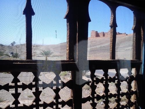 a view of a desert from a window of a building at Kasbah Itrane in Tamnougalt