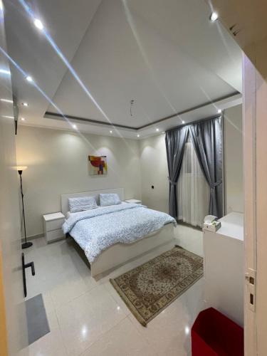 a bedroom with a large bed in a room at غرفتين نوم وصاله & in Riyadh