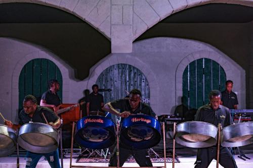 a group of men playing drums in a room at Catalonia Montego Bay - All Inclusive in Montego Bay