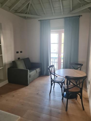 a living room with a table and chairs and a couch at LorPalma in Los Sauces