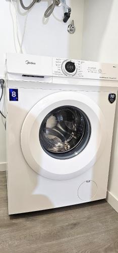 a white washing machine sitting in a room at Vacansis Masamagrell Bajo Loft Tomas y Valiente in Masamagrell