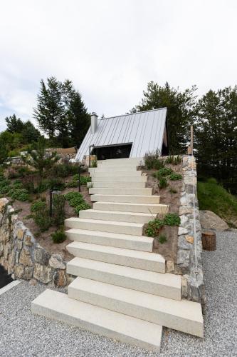 a set of stairs leading up to a building at Pine Hill RUBY in Rakitna
