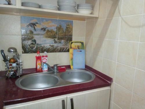 a sink in a bathroom with at Квартира в тихом дворе in Baku