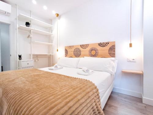Ένα ή περισσότερα κρεβάτια σε δωμάτιο στο AKURA apartment, con aire acondicionado