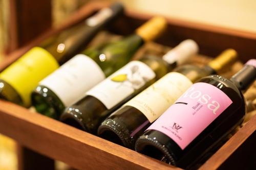 a bunch of wine bottles in a wooden box at Hotel Wilga by Katowice Airport in Pyrzowice