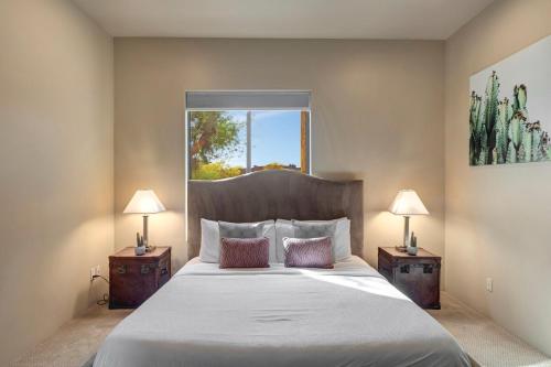 a bedroom with a large bed with two night stands at Gamble in Scottsdale