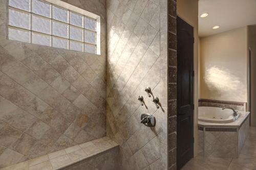 a bathroom with a shower and a sink at Gamble in Scottsdale