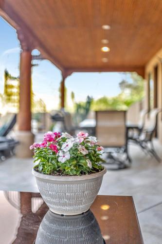 a vase filled with flowers sitting on a table at Gamble in Scottsdale
