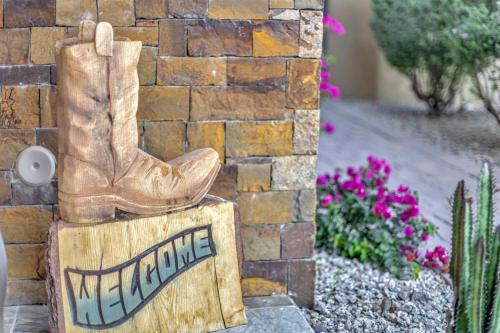 a sign for a yard with a cowboy boot on it at Gamble in Scottsdale