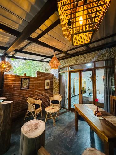 a room with a wooden table and chairs at La Casa Bella in Ella
