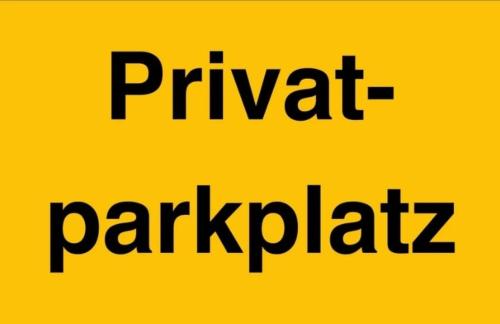 a yellow sign with the wordspritt parksphalt at Modern Apartments Neuburg C - TOP - 3 Zimmer, Stellplatz, Zentrum, Wi-Fi, 3 TV, Küche in Neuburg an der Donau