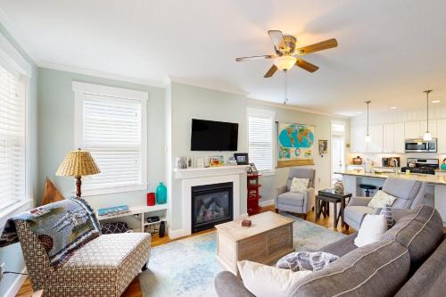 a living room with a couch and a fireplace at Knot a Care in Lincoln City