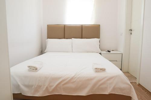 Postel nebo postele na pokoji v ubytování Mega Hotel