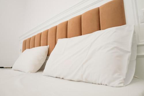 Postel nebo postele na pokoji v ubytování Mega Hotel