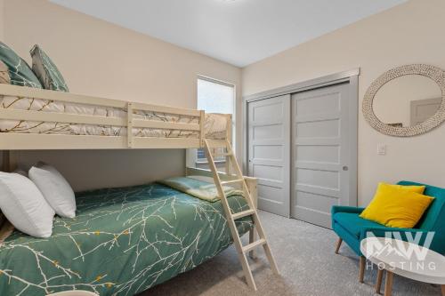 a bedroom with a bunk bed and a chair at RSD 3041 in Coeur d'Alene