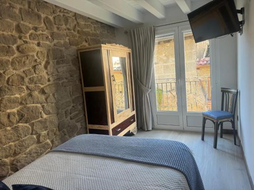 Ein Bett oder Betten in einem Zimmer der Unterkunft Casa Rural Garabitero