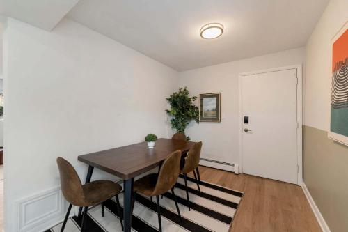 a dining room with a wooden table and chairs at Free Parking Workdesk King Bed in Lombard
