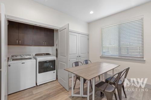 a kitchen with a table and chairs and a stove at RSD 3040 in Coeur d'Alene