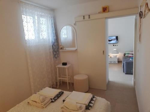 a room with two towels sitting on the floor at Apartman Olly in Klek