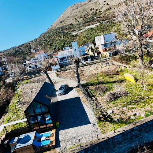 an aerial view of a house on a hill at 446 Tiny House Zues in Shkodër
