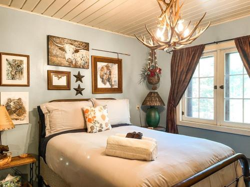 a bedroom with a bed with a stuffed animal on it at Mountainside Cabin_peaceful_near hiking trails in Chipita Park