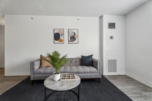 a living room with a couch and a table at Legacy At Imperial Village 314 I 2 Bed 2 Bath in Richmond