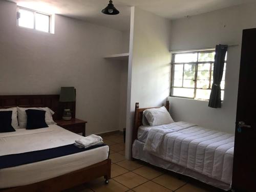 Postel nebo postele na pokoji v ubytování Hotel Gandag