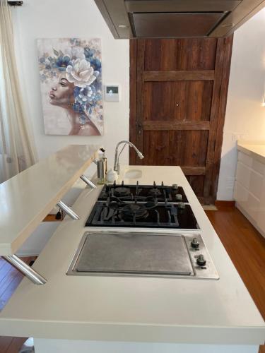 a kitchen with a stove top oven in a kitchen at Casa Klod Ibiza in Ibiza Town