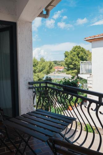 a bench on the balcony of a building at Guesthouse Tamara in Lovište