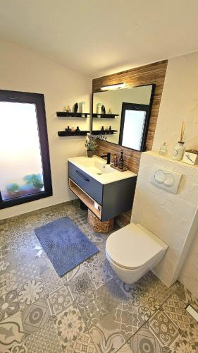 a bathroom with a sink and a toilet and a mirror at Magic view in Sveti Filip i Jakov