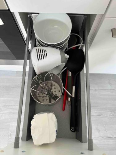 a kitchen utensils are organized in a drawer at Souterrain Wohnung in Vellmar bei Kassel in Vellmar