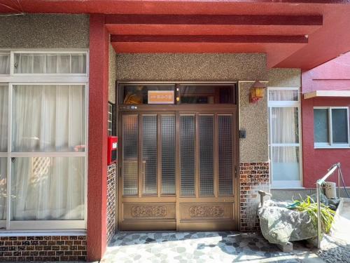 a front door of a building with ajar door at Guesthouse Smile Inn - Vacation STAY 28738v in Miyoshi