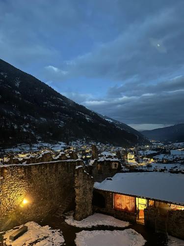 a view of a town with snow on the ground at Rifugio del Sole Apartment in Monclassico