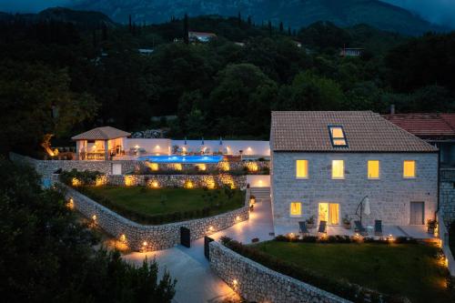 an image of a house with lights in the yard at Villa Emelie in Dubravka