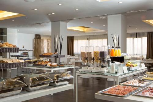 a buffet line with many different types of food at Best Western Plus Tower Hotel Bologna in Bologna
