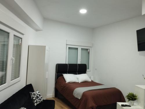 Postel nebo postele na pokoji v ubytování Apartamento tipo Loft HM Vista Alegre Madrid