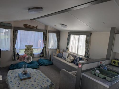 Χώρος καθιστικού στο Yarmouth Holiday Home