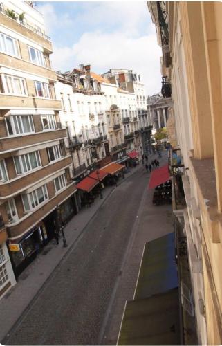 a view of a city street with buildings at Heart of Brussels Escape, Steps from Bourse in Brussels