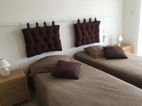 Cama o camas de una habitación en Locations I Carboni - villa 2 chambres