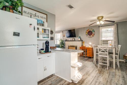 a kitchen with a refrigerator and a dining room at Louisiana Roots Home 3 Mi to Dtwn West Monroe! in West Monroe